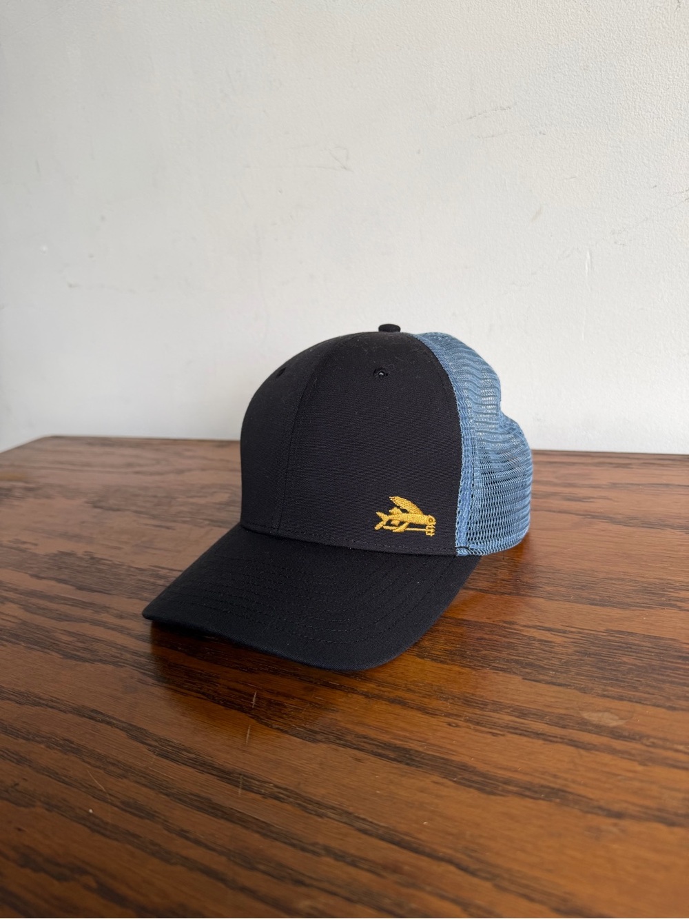 Patagonia Black Front Blue Mesh Trucker Hat with Yellow Logo